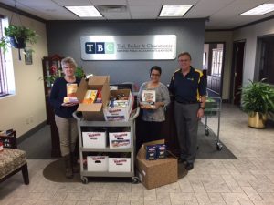 TBC employees donating canned goods