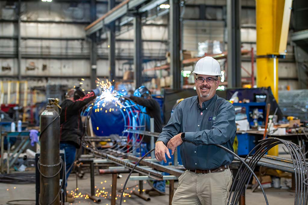 Man in hardhat in manufacturing facility